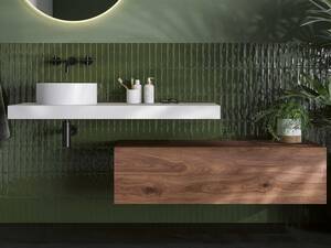 Der Mineralwerkstoff Corian des puristischen Aufsatzwaschbeckens «Sleek» überzeugt durch eine glatte, porenlose und pflegeleichte Oberfläche. Talsee AG.