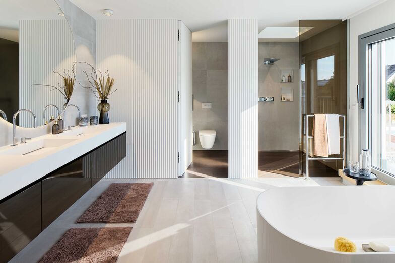 Hochwertige Materialien geben dem Bad Eleganz.