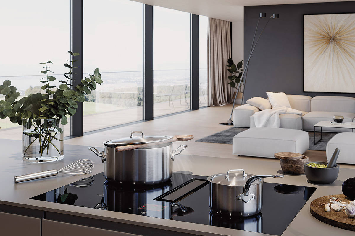 Integrierter Abzug und intuitive Bedienung auf dem Grafikdisplay: Kochfeld «Fusion» vereint zwei Funktionen. V-Zug.